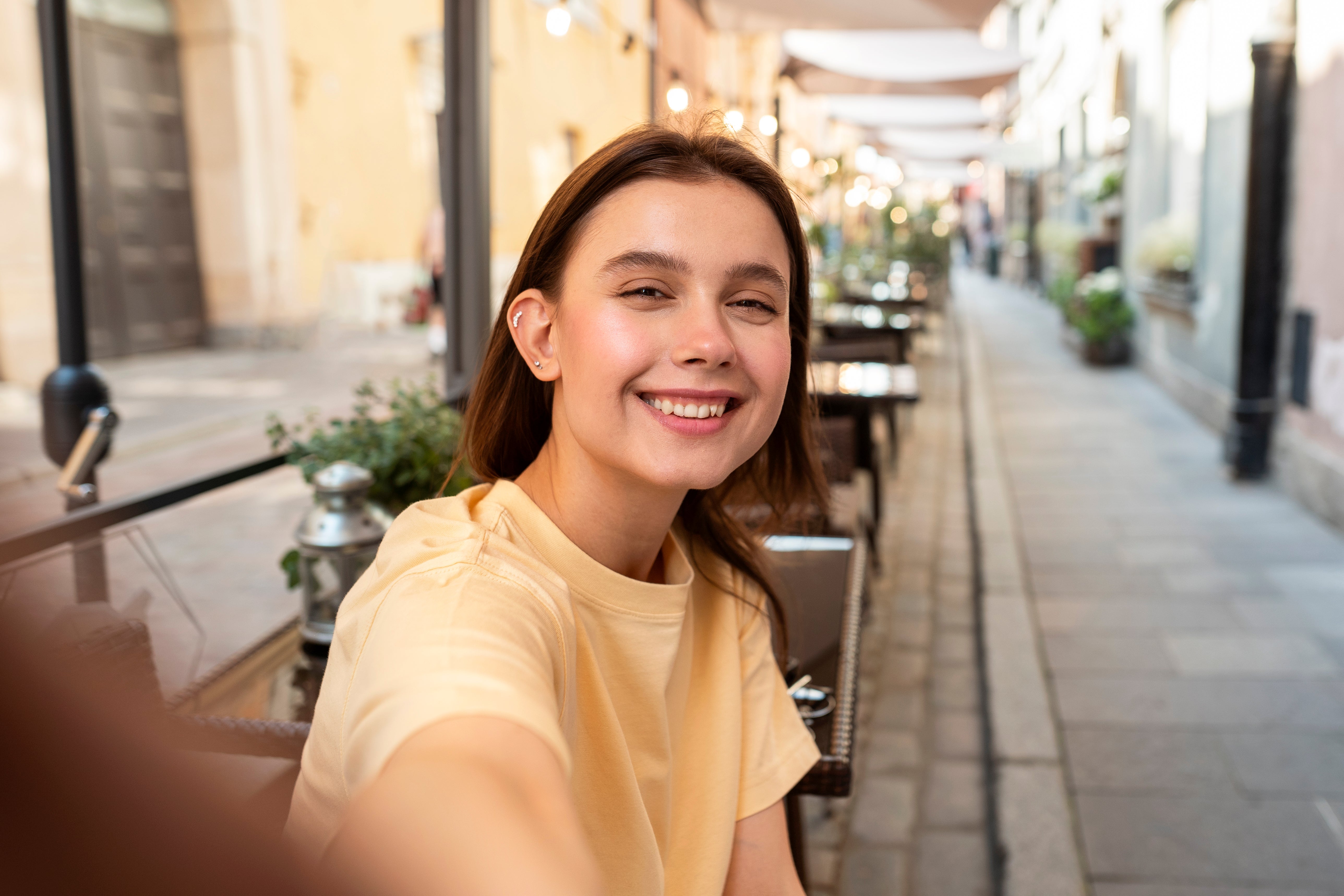 files/medium-shot-smiley-woman-taking-selfie-outside_1.jpg